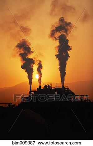 Smoke billowing from chemical factory View Large Photo Image Stock Photo - Smoke billowing from chemical factory. Fotosearch