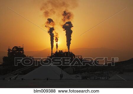Smoke billowing from chemical factory View Large Photo Image Stock Photo - Smoke billowing from chemical factory. Fotosearch