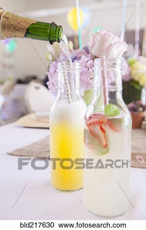 Stock Image - Soda and cocktails on party table. Fotosearch