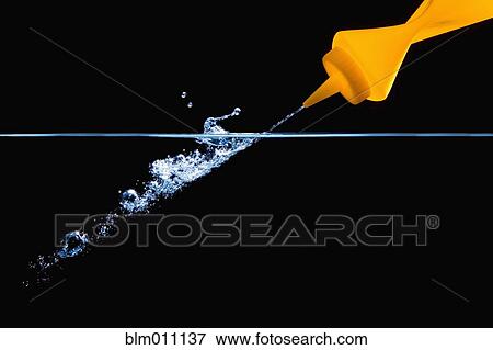 Stock Photo - Squeeze bottle squirting water. Fotosearch
