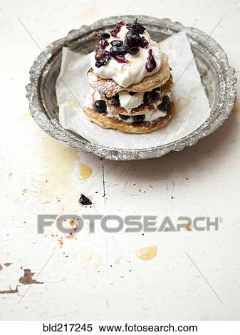 Stock Photography - Stack of cookies with fruit and cream. Fotosearch