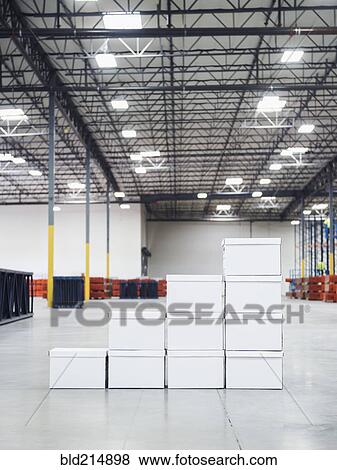 Stacked boxes in warehouse View Large Photo Image Stock Photo - Stacked boxes in warehouse. Fotosearch