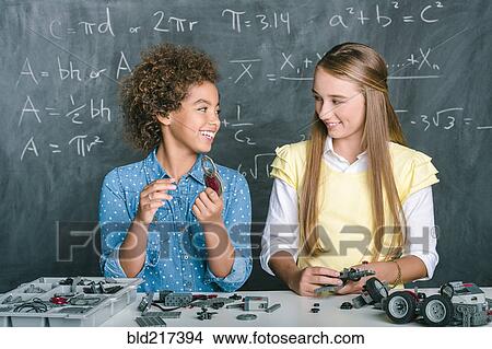 Picture - Students building vehicle in science class. Fotosearch