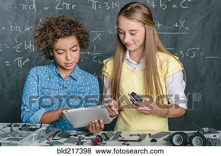 Stock Photo - Students building vehicle in science class. Fotosearch