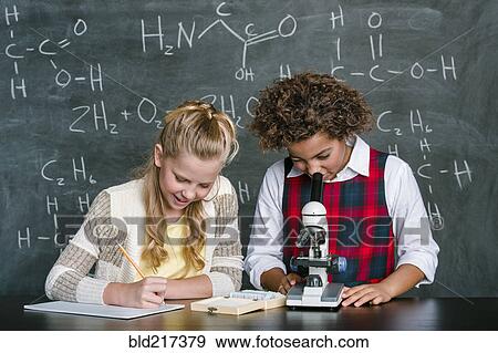 Students doing experiment in science class View Large Photo Image Stock Photo - Students doing experiment in science class. Fotosearch