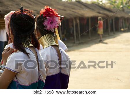 Students wearing traditional jewelry near huts View Large Photo Image Stock Photo - Students wearing traditional jewelry near huts. Fotosearch