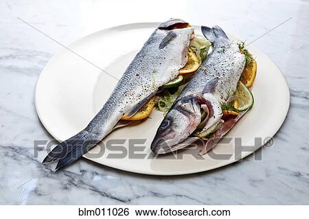 Stock Photograph - Stuffed fish on plate. Fotosearch