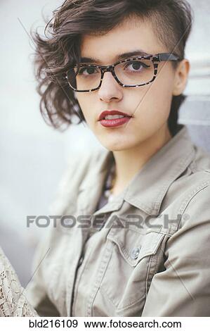 Stylish Caucasian woman wearing eyeglasses View Large Photo Image Stock Photo - Stylish Caucasian woman wearing eyeglasses. Fotosearch