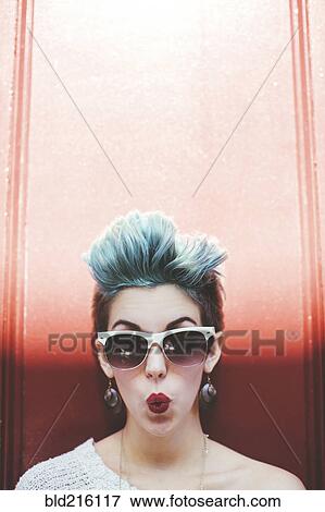 Stock Photo - Stylish Caucasian woman with sunglasses and dyed hair. Fotosearch