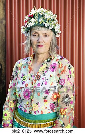 Stock Photography - Stylish older Caucasian woman wearing floral cap. Fotosearch