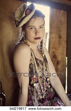 Stylish woman sitting in barn window View Large Photo Image Stock Photo - Stylish woman sitting in barn window. Fotosearch