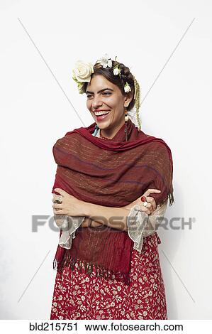 Stock Image - Stylish woman wearing shawl and flowers in hair. Fotosearch