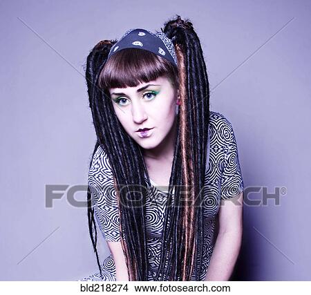 Stylish woman with makeup and dyed dreadlocks View Large Photo Image Picture - Stylish woman with makeup and dyed dreadlocks. Fotosearch