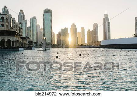 Sunset over city skyline, Dubai, United Arab Emirates View Large Photo Image Stock Image - Sunset over city skyline, Dubai, United Arab Emirates. Fotosearch