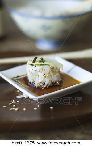 Sushi, sauce and chopsticks on tray View Large Photo Image Stock Photography - Sushi, sauce and chopsticks on tray. Fotosearch