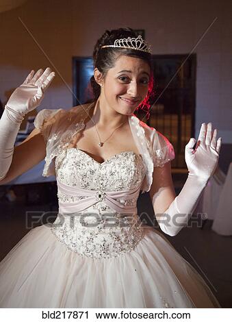 Teenage girl posing in quinceanera dress View Large Photo Image Stock Image - Teenage girl posing in quinceanera dress. Fotosearch