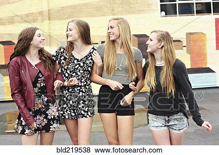 Stock Photo - Teenage girls walking outdoors. Fotosearch