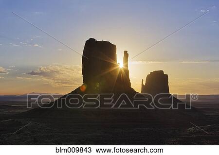 Stock Image - The Mittens rock formation at sunrise. Fotosearch