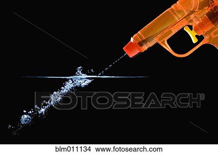 Toy gun squirting water View Large Photo Image Picture - Toy gun squirting water. Fotosearch