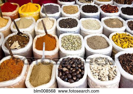 Variety of colorful Indian spices in sacks View Large Photo Image Stock Photo - Variety of colorful Indian spices in sacks. Fotosearch