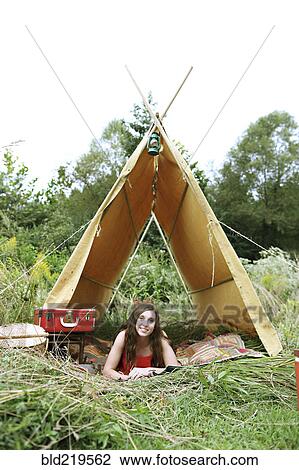 Woman laying in camping tent in field View Large Photo Image Stock Image - Woman laying in camping tent in field. Fotosearch