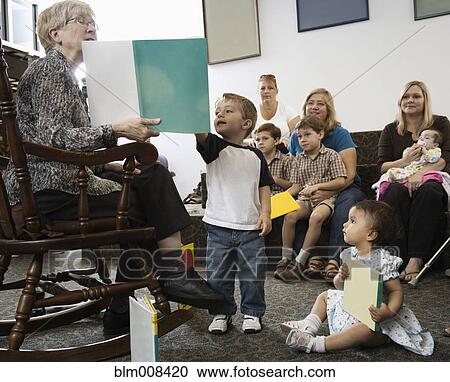 Woman reading story to small children View Large Photo Image Stock Image - Woman reading story to small children. Fotosearch