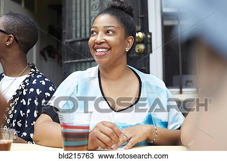 Woman relaxing at table View Large Photo Image Stock Image - Woman relaxing at table. Fotosearch