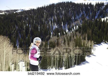 Woman skiing on snowy slope View Large Photo Image Stock Image - Woman skiing on snowy slope. Fotosearch