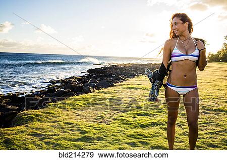Woman wearing bikini near ocean View Large Photo Image Stock Photo - Woman wearing bikini near ocean. Fotosearch