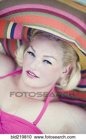 Woman wearing sun hat and bathing suit View Large Photo Image Stock Image - Woman wearing sun hat and bathing suit. Fotosearch
