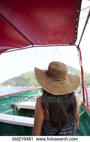 Woman wearing sun hat on ferry boat View Large Photo Image Stock Image - Woman wearing sun hat on ferry boat. Fotosearch