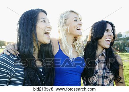 Women laughing outdoors View Large Photo Image Stock Photo - Women laughing outdoors. Fotosearch