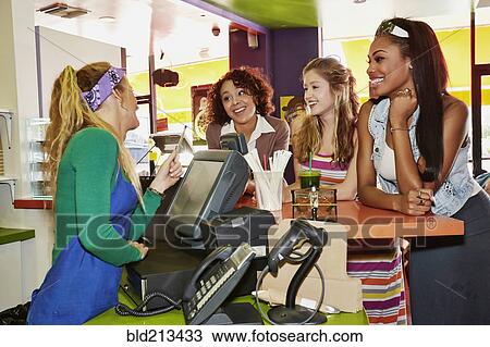 Women ordering from server in cafe View Large Photo Image Stock Image - Women ordering from server in cafe. Fotosearch