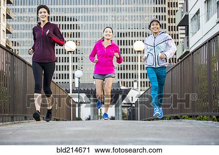 Stock Image - Women running in city. Fotosearch