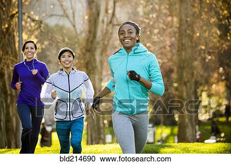 Women running in park View Large Photo Image Stock Image - Women running in park. Fotosearch