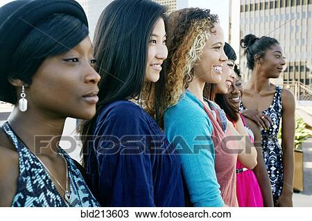 Women smiling on urban rooftop View Large Photo Image Stock Image - Women smiling on urban rooftop. Fotosearch