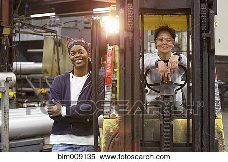 Workers and forklift in factory View Large Photo Image Stock Photography - Workers and forklift in factory. Fotosearch