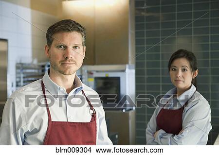 Picture - Workers standing together in cafe. Fotosearch