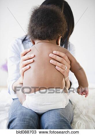 African American mother holding baby boy View Large Photo Image Stock Image - African American mother holding baby boy. Fotosearch