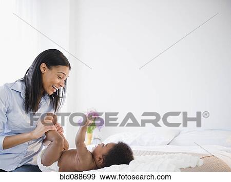 African American mother playing with baby boy View Large Photo Image Stock Photo - African American mother playing with baby boy. Fotosearch