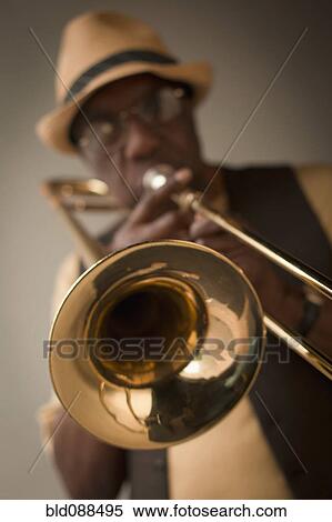 Stock Photography - African American musician playing trombone. Fotosearch