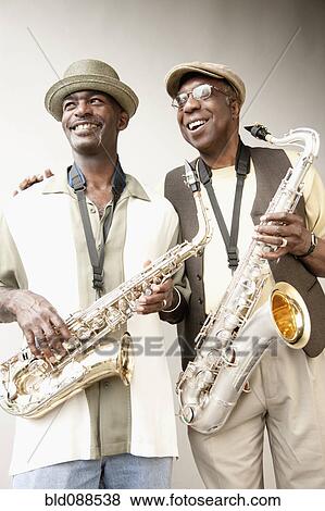 African American musicians holding saxophones View Large Photo Image Stock Photo - African American musicians holding saxophones. Fotosearch