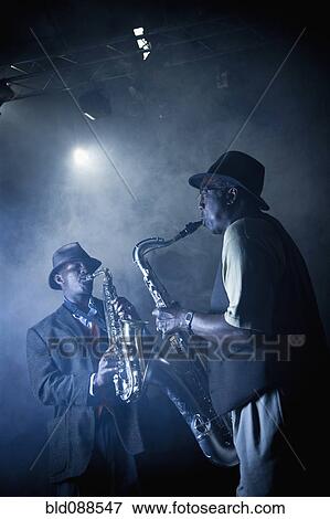 Stock Photo - African American musicians playing in jazz band on stage. Fotosearch
