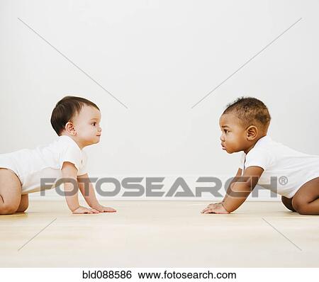 Stock Photograph - Babies crawling on floor. Fotosearch