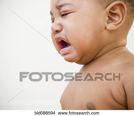 Picture - Black baby crying. Fotosearch