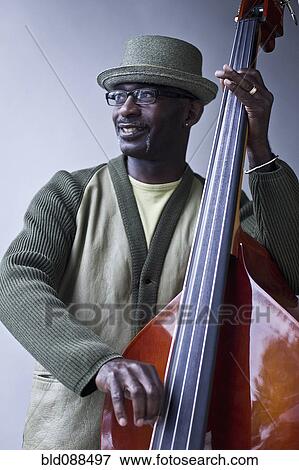 Black musician playing double bass View Large Photo Image Stock Photo - Black musician playing double bass. Fotosearch