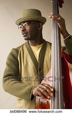 Black musician playing double bass View Large Photo Image Stock Photograph - Black musician playing double bass. Fotosearch