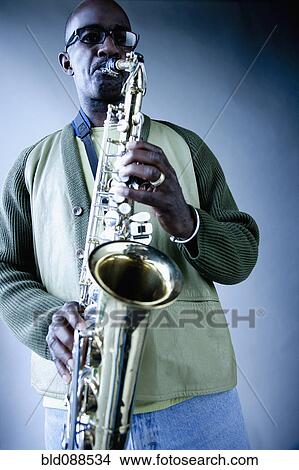 Black musician playing saxophone View Large Photo Image Picture - Black musician playing saxophone. Fotosearch