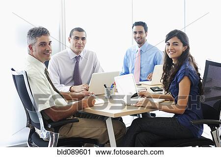 Business people working together in conference room View Large Photo Image Stock Image - Business people working together in conference room. Fotosearch
