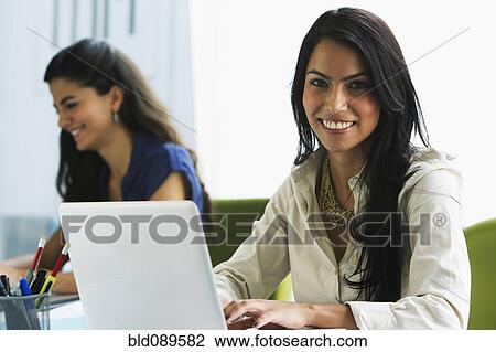 Businesswomen working on office View Large Photo Image Stock Image - Businesswomen working on office. Fotosearch